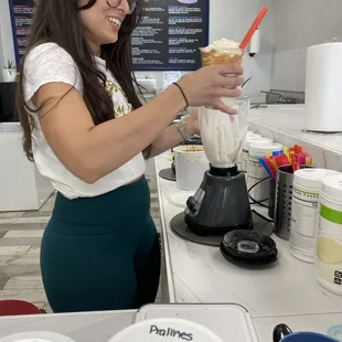 Gloria making a shake