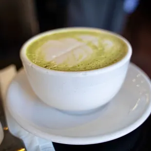 a cup of matcha on a saucer
