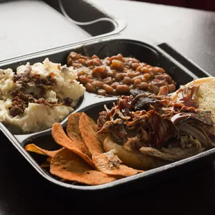 pulled pork, mashed potatoes, and baked potatoes