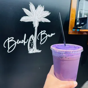 White chocolate ube cold brew with soft top and toasted coconut
