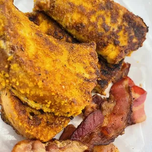 a plate of bacon and fried chicken