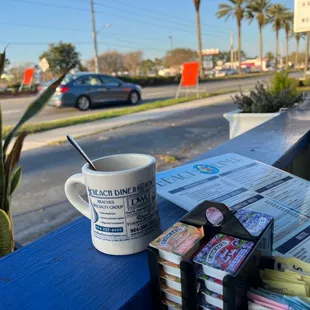 Enjoying the coffee in my curbside booth