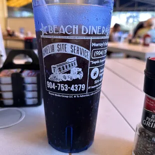 a plastic cup with a straw in it