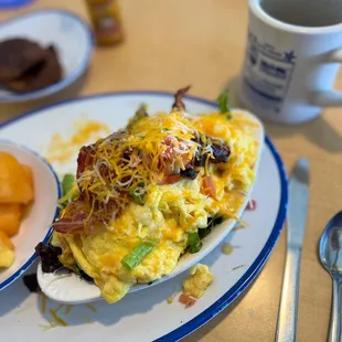 an omelet with a side of fruit