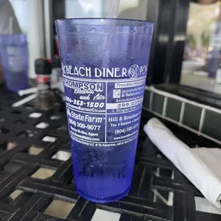 a blue plastic cup with a straw