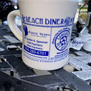 a coffee cup on a table
