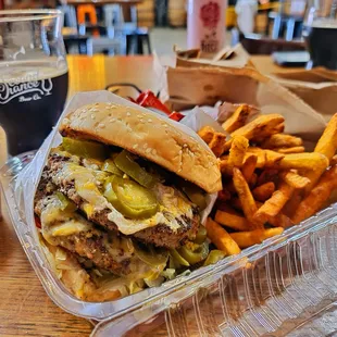 a burger and fries on a table