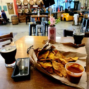 nachos and beer on a table