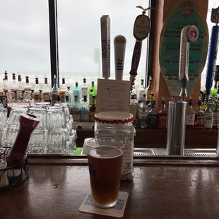 a pint of beer on the bar
