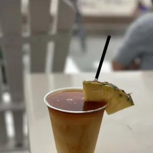  drink with a pineapple garnish