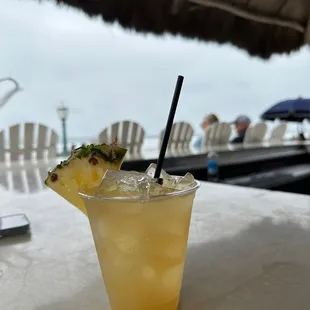  drink with a pineapple garnish