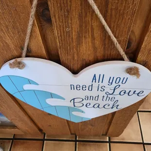 a wooden heart hanging on a door