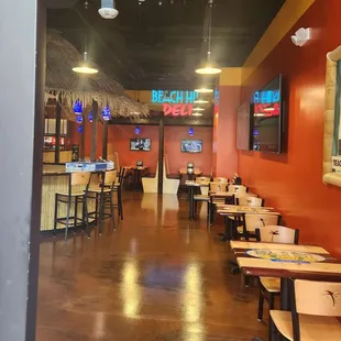 Clean interior seating with TVs. Very nice.