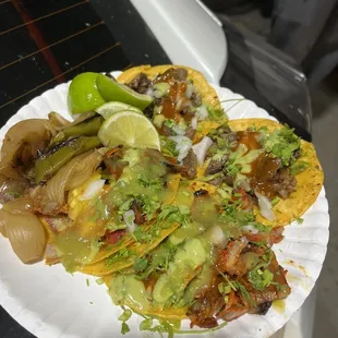 a plate of tacos on a table