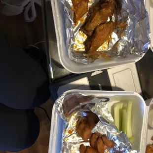 two trays of chicken wings