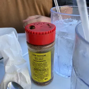 a bottle of groundnut butter and a glass of water