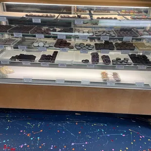 a display case with a variety of desserts