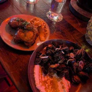 Korean fried Chicken and char grilled brussel sprouts on the right