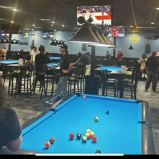 a pool table in a sports bar