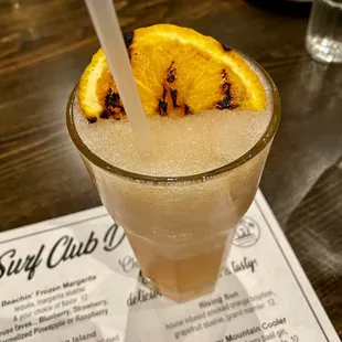 Rising Sun Cocktail with Smoked Orange Bourbon, Grapefrult Slushie, and Grand Marnier - Beaches Restaurant
