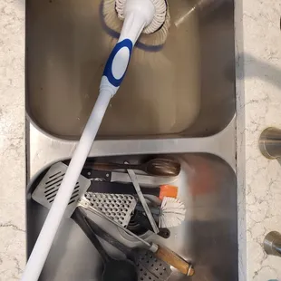 Moldy utensils and water from cleaning the moldy floors