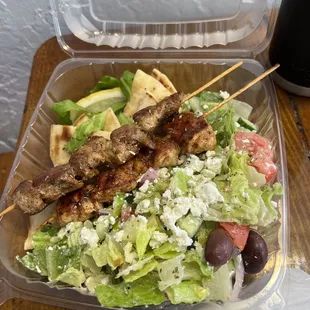 One Pork and one Chicken Souvlaki and Greek Salad.