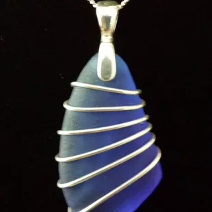 &quot;Sailor&quot;
This 1.25&quot; Hawaiian Cobalt Blue Seaglass pendant is wrapped in 21 gauge S.S. wire, handcrafted at Pu&apos;ulei Designs...