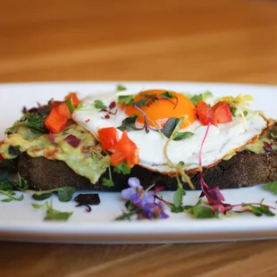 avocado toast - country sourdough, housemade guacamole,over easy egg