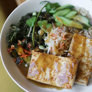 Sophia bowl - mirin sesame tofu, basmati brown rice, braised kale, cucumbers, daikon pickles, sweet peanut sauce, housemade kimchi