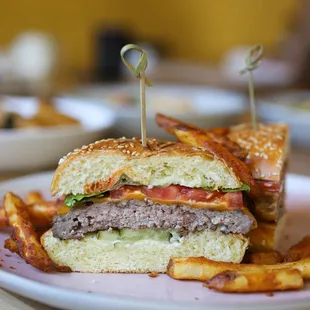 Cheeseburger - fresh ground chuck, romaine, cheddar, beefsteak tomato, pickles, herb aioli, spicy fennel ketchup