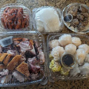 Top: Chicken feet, sweet rice cake, and spare ribs w/rice rolls  Bottom: Roast pork and a variety of shrimp/pork dumplings.
