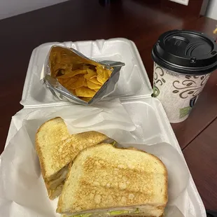 Turkey club, chips, and cafe con leche