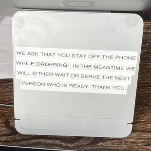 Sign at register