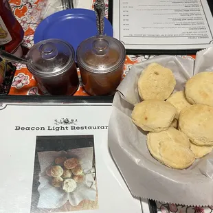 Yummy biscuits, peach preserves and strawberry preserves- both tasty