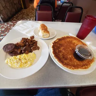 two plates of breakfast food on a table