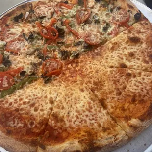 a whole pizza on a plate