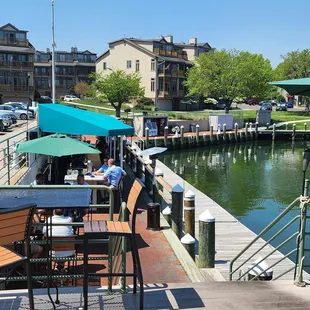 Dock bar with seating at the water's edge