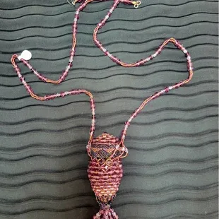 Beaded necklace with beaded pouch