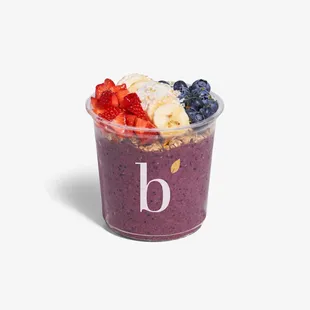 Acai Superfood Bowl. Acai, blueberry, banana, almond milk. Topped with superfood granola, seasonal berries and honey drizzle.