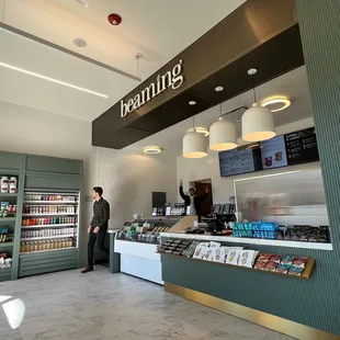 a man standing in front of a food counter