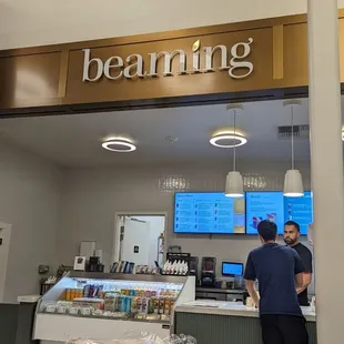  man standing in front of a bakery counter