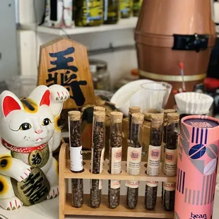 a cat figurine and a variety of spices