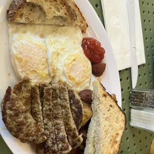 Sausage ,fried eggs, breakfast potato&apos;s &amp; toast! So good