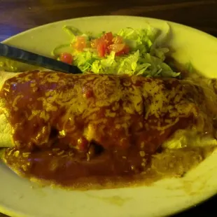 Deluxe burrito with red sauce, lettuce and tomato.
