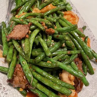 a plate of stir fried green beans