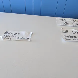 a white refrigerator with labels on it