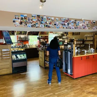 a woman standing in a coffee shop