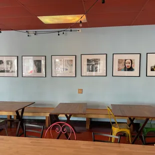 a row of tables and chairs in a restaurant