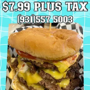 a picture of a hamburger with cheese and tomato