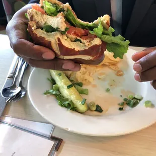 a man holding a sandwich